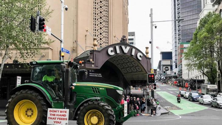 New Zealand farmers hit streets to protest cow-burp tax plan