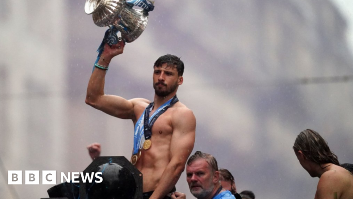 Manchester City fans and players celebrate historic Treble in the rain