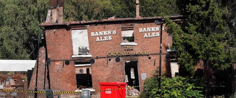 Angry villagers in England call for the quirky Crooked House pub to be rebuilt following demolition