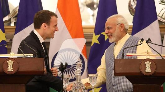 Indian Prime Minister Narendra Modi (R) and French President Emmanuel Macron (L) shake hands as they make a joint press statement in New Delhi on March 10, 2018.